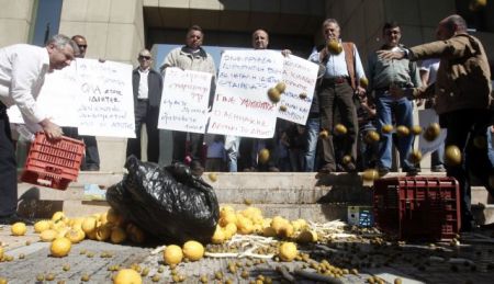 Farmers protest against real estate tax bill outside Parliament