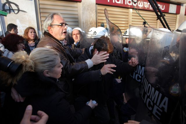 Suspended cleaning staff and riot police clash outside Treasury