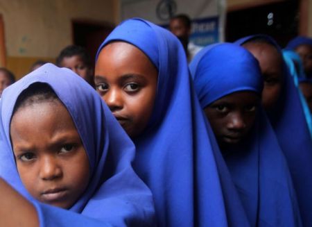 Somali students queue outside a classroom to attend examination classes at Bustaale Primary and Secondary school in capital Mogadishu