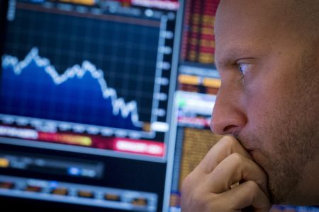 A specialist trader works on the floor of the New York Stock Exchange