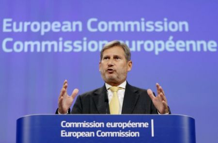Hahn addresses a news conference in Brussels