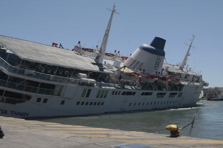 Ferry boat docked in Piraeus taking in water and sinking