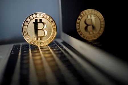 FILE PHOTO: A Bitcoin (virtual currency) coin is seen in an illustration picture taken at La Maison du Bitcoin in Paris