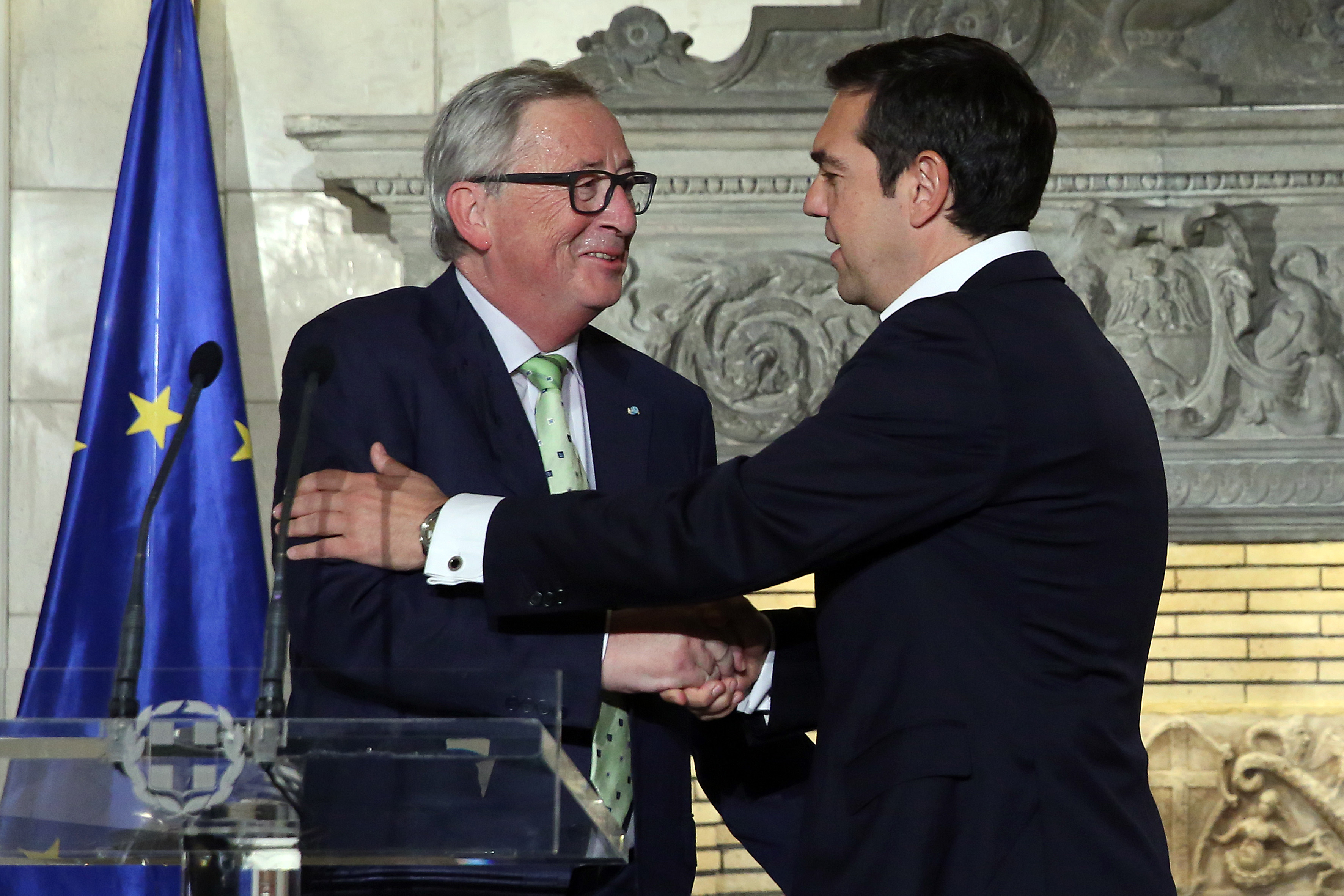 Juncker in Athens sees clean bailout exit, debt relief deal