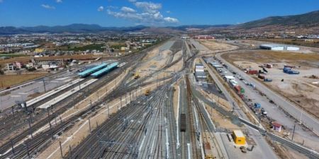 How will the train reach the industrial area and the port of Volos