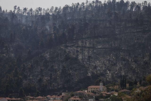 Στων Ευβοέων την ολόμαυρη ράχη…