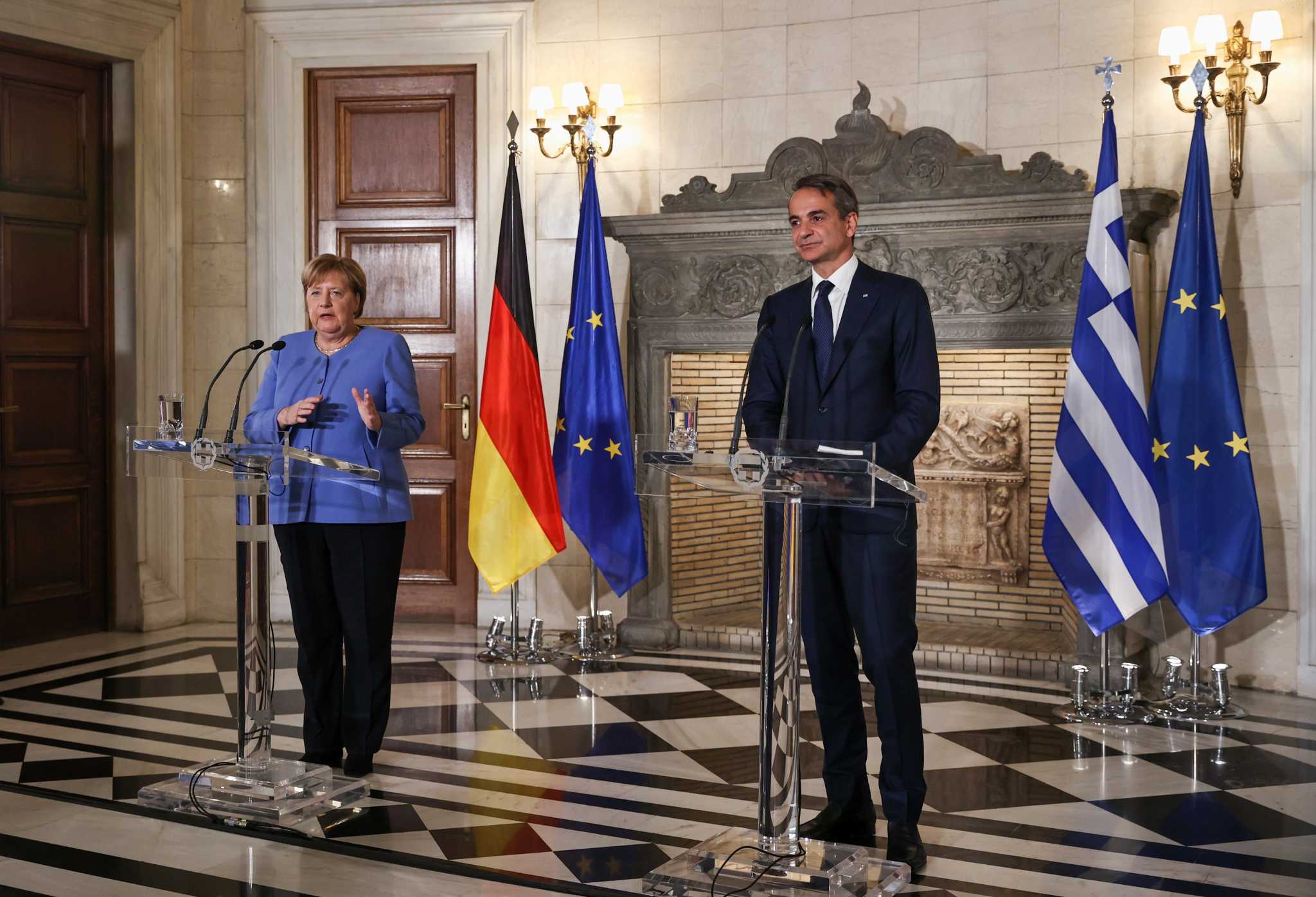 Merkel says she ‘demanded much of the Greeks’ but it was necessary to protect the common currency